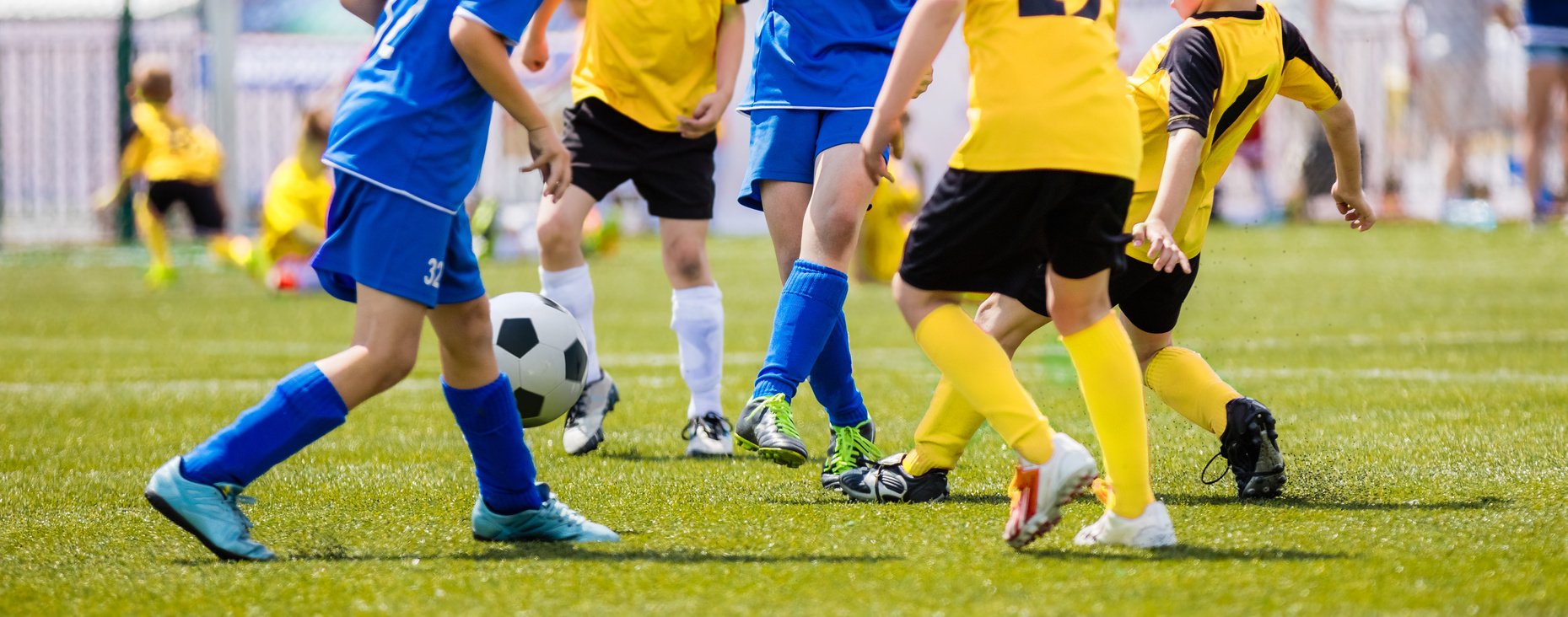 Soccer Shot. Young Boys Kicking Football Soccer Tournament Match